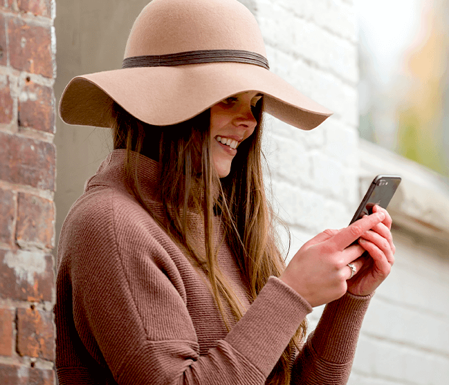 Woman outside texting