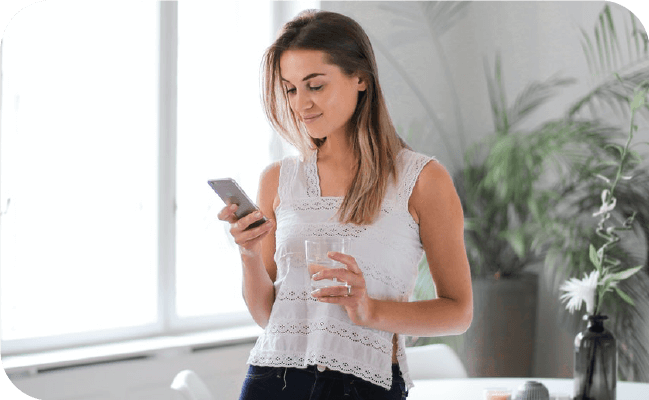 Woman managing her SMS contact list on her smartphone