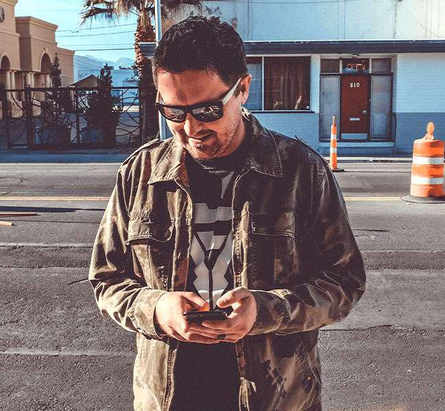 Happy man texting