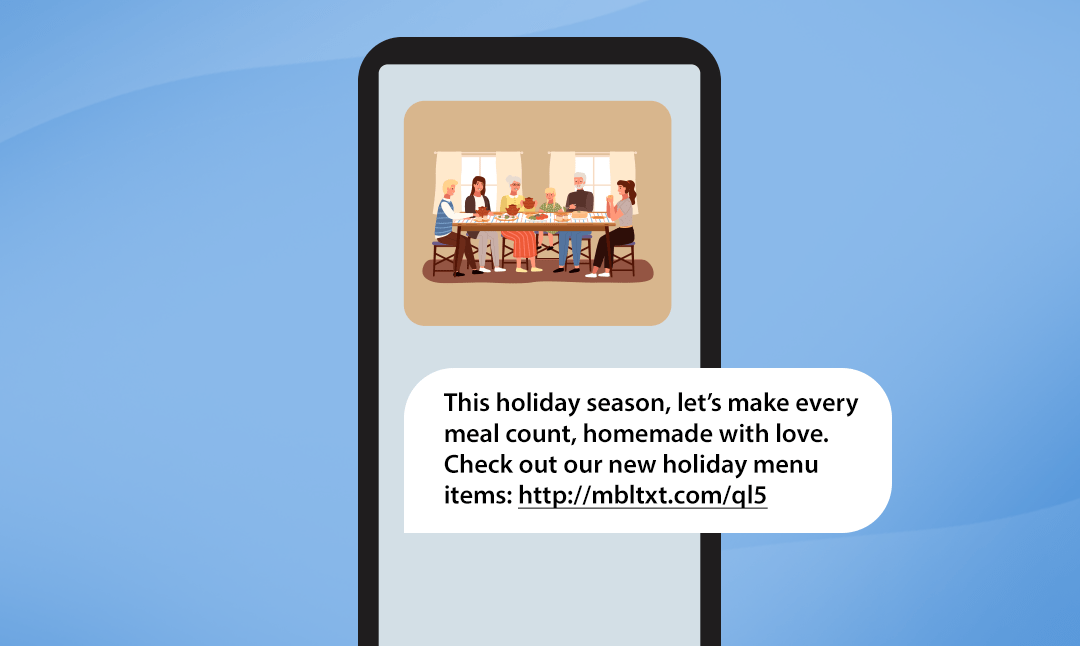 A phone with an MMS showing a touching photo of a family sharing a meal with the corresponding text message below