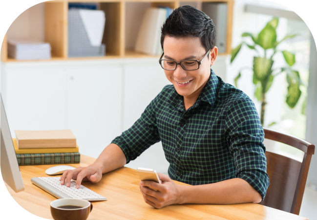 Businessman uses SMS opt in on his mobile device while working