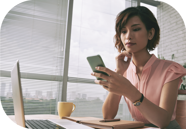 Business woman uses SMS opt in on her mobile device